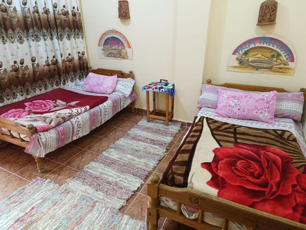Postel nebo postele na pokoji v ubytování فندق النخيل