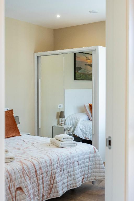 Postel nebo postele na pokoji v ubytování Apartamentos Cuetumerin