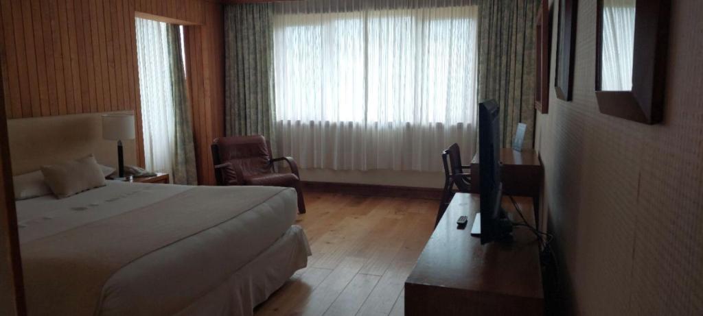 Postel nebo postele na pokoji v ubytování Hotel y Cabañas Llanuras de Diana - Caja Los Andes