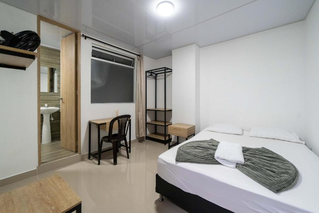 Postel nebo postele na pokoji v ubytování Hotel Doxa