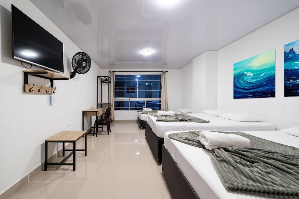 Postel nebo postele na pokoji v ubytování Hotel Doxa