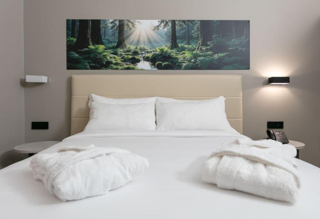 Postel nebo postele na pokoji v ubytování Break Hotel