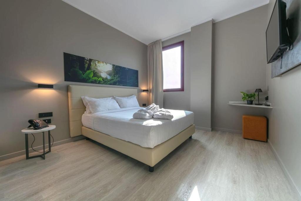 Postel nebo postele na pokoji v ubytování Break Hotel