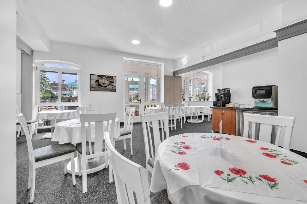 Telewizja i/lub zestaw kina domowego w obiekcie Hotel Ferdinand