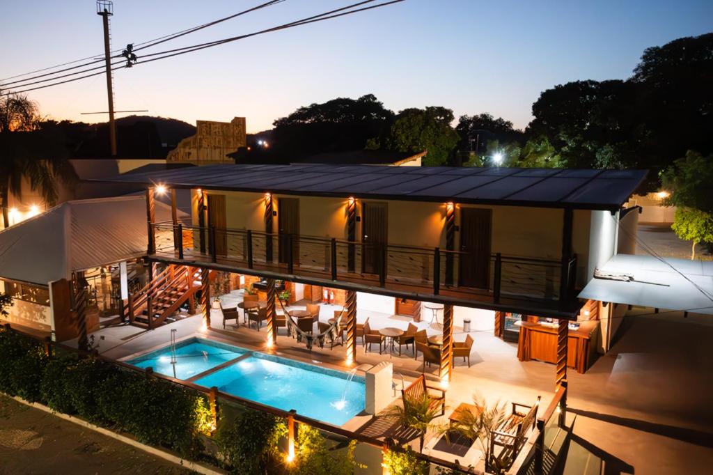 an aerial view of a house with a swimming pool at Pousada Recanto Dourado in Bonito