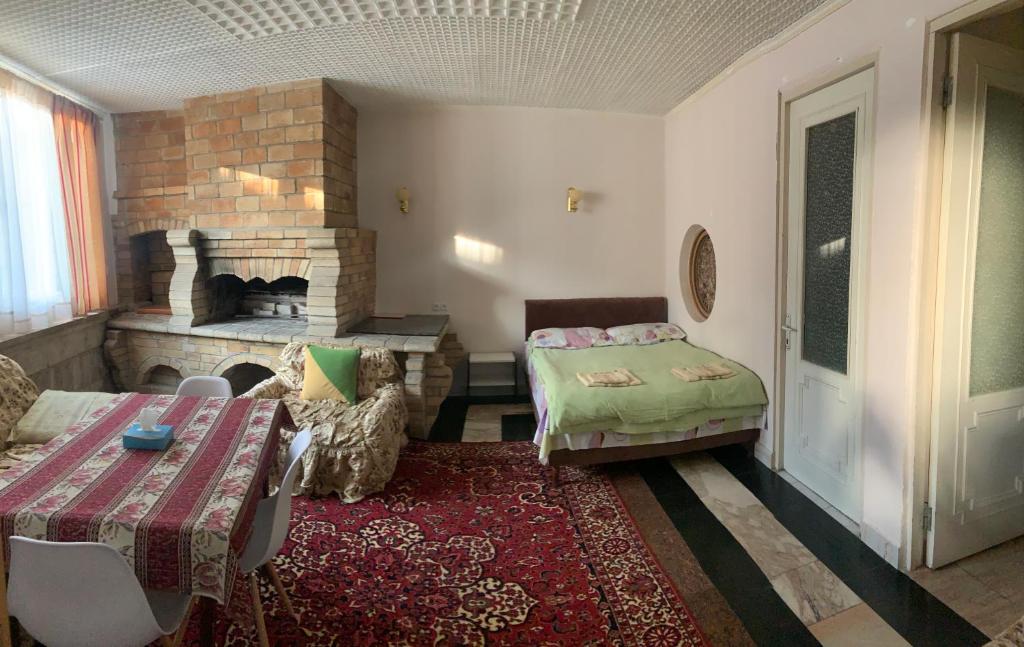 Postel nebo postele na pokoji v ubytování Guest House Lilia
