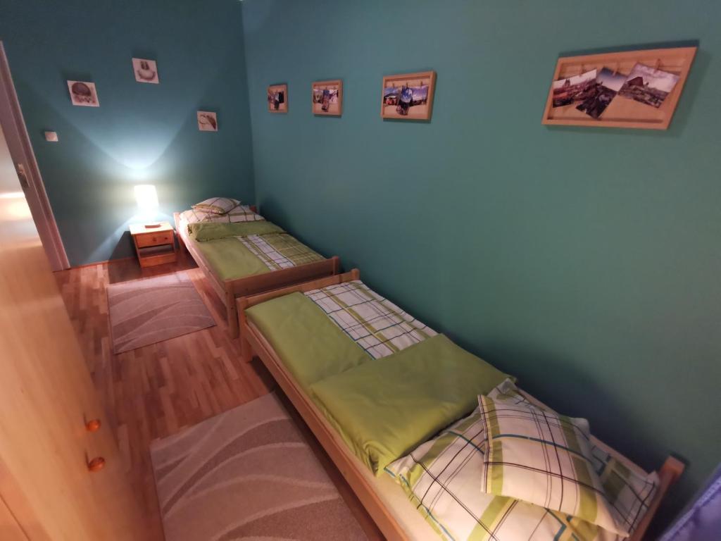 Postel nebo postele na pokoji v ubytování Boros Vendégház Eger