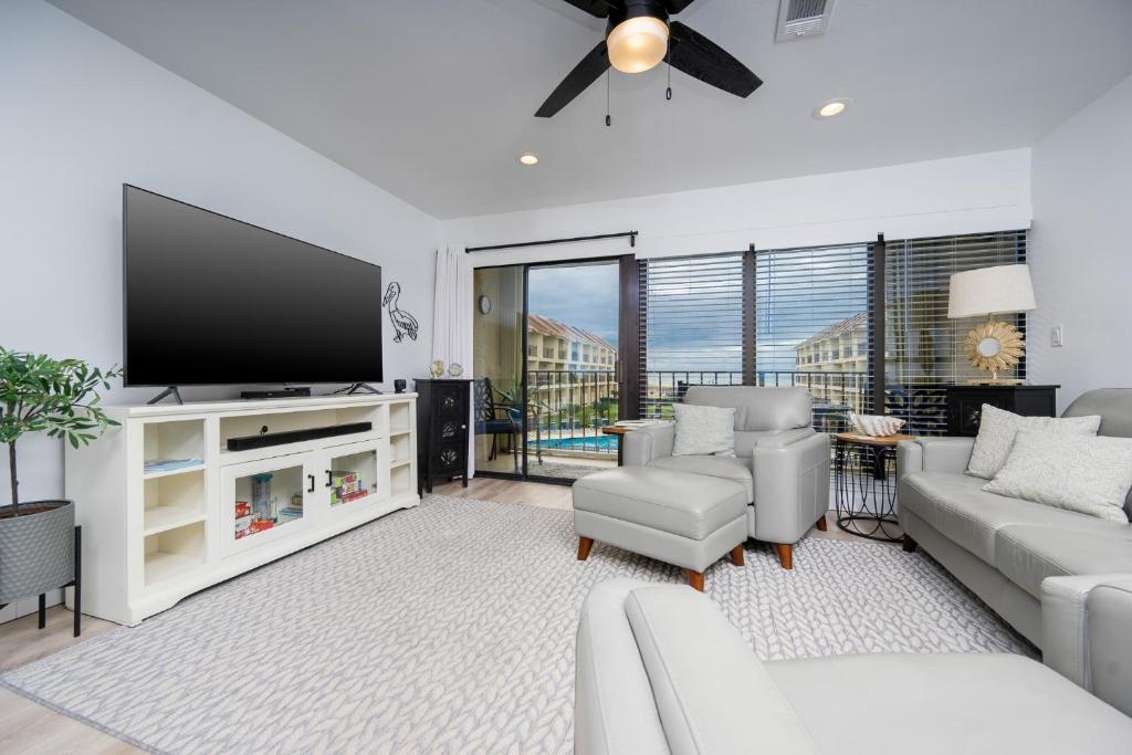 a living room with a large flat screen tv at Gulf Side Townhomes 20 condo in Gulf Shores