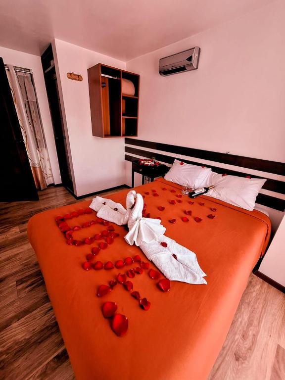 Postel nebo postele na pokoji v ubytování Pukantu Hostal