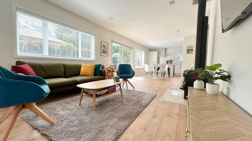 a living room with a couch and a table at 34 Jacks Pass Road in Hanmer Springs