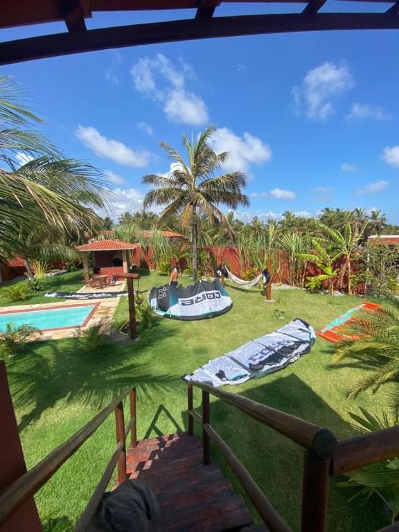 a view from the balcony of a resort with a playground at Kitesurf Oasis Maracajaú in Maracajaú
