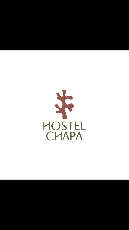 a logo for a houston chicago restaurant at Hostel Chapa in Chapadmalal