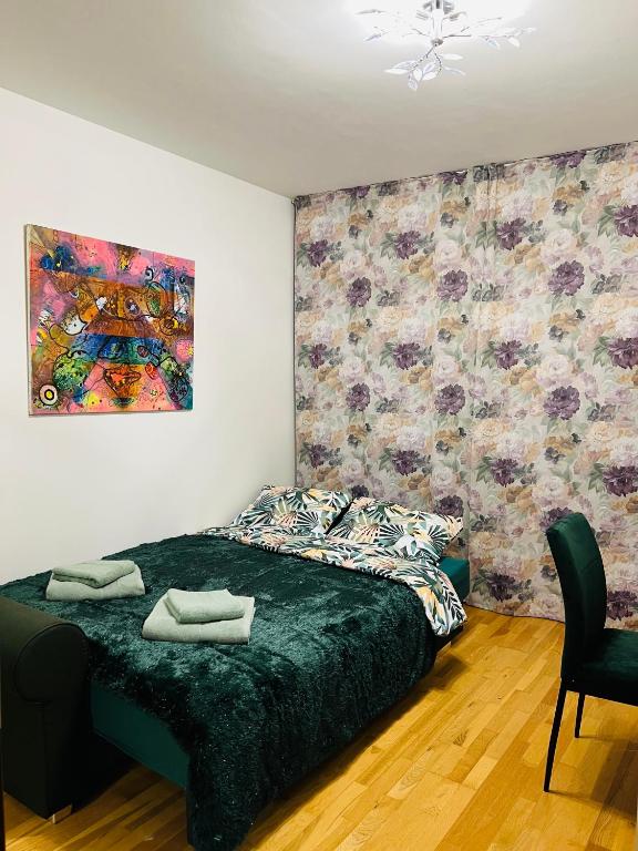 Кровать или кровати в номере ArtFlora KV Premium