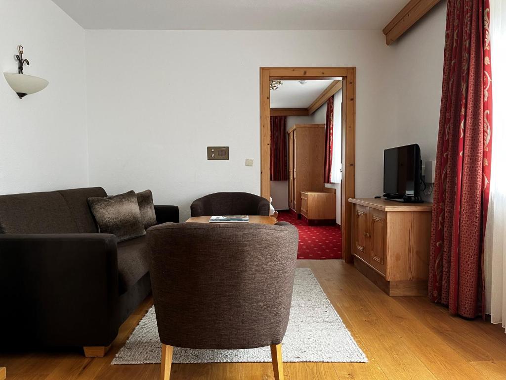 Televízia a/alebo spoločenská miestnosť v ubytovaní Appartements Maria Theresia