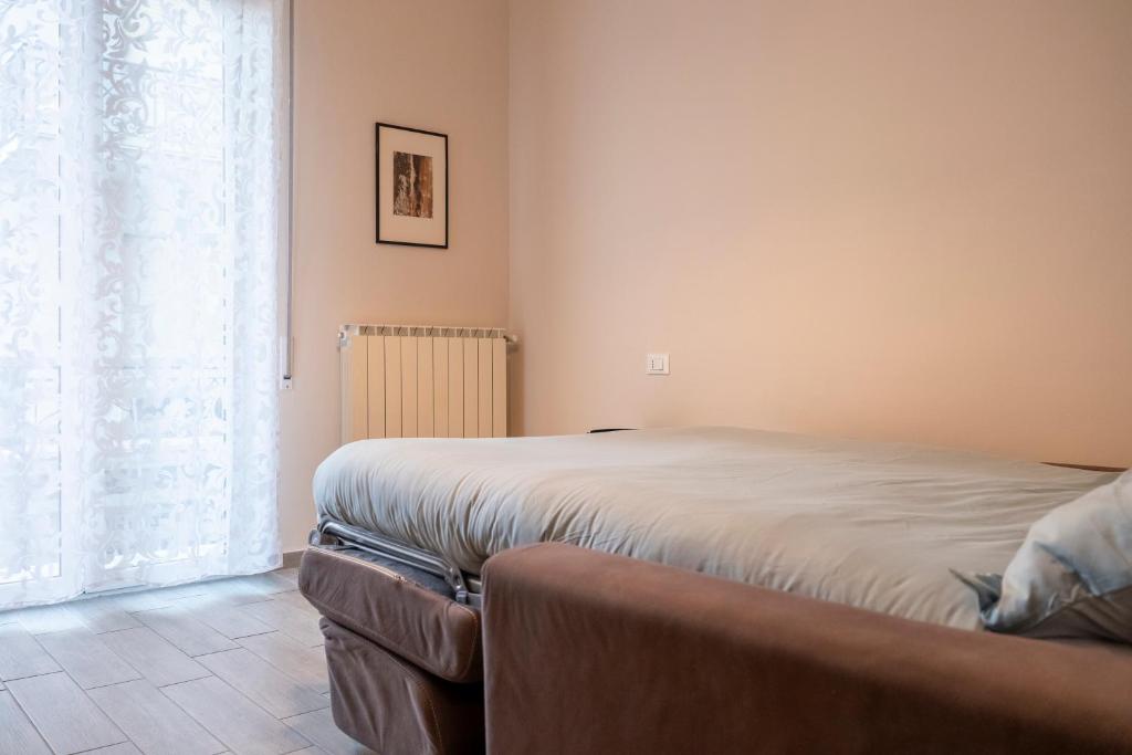 Postel nebo postele na pokoji v ubytování Al numero 6, Trilocale luminoso e accogliente a pochi passi dal mare