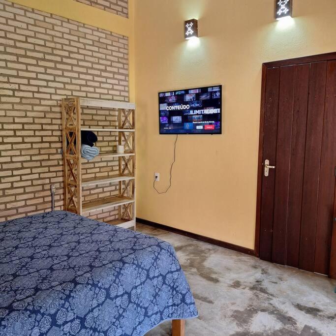 Postel nebo postele na pokoji v ubytování Chalé da LUA Natureza Cachoeira Paz