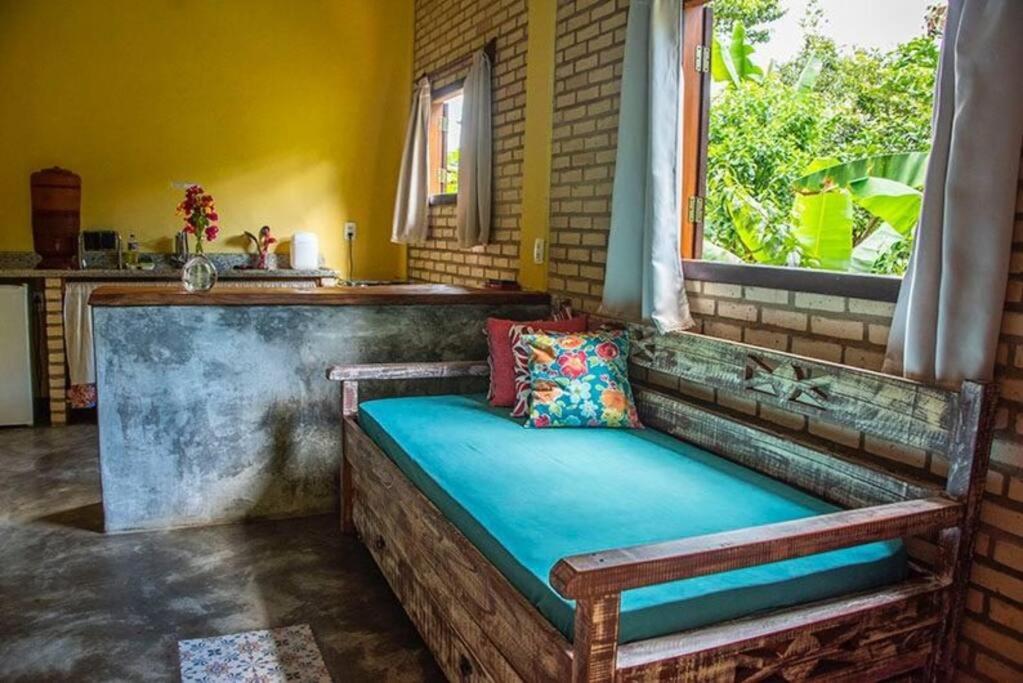 Postel nebo postele na pokoji v ubytování Chalé da LUA Natureza Cachoeira Paz