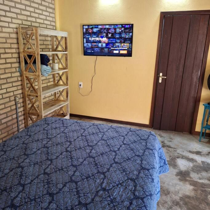 Postel nebo postele na pokoji v ubytování Chalé da LUA Natureza Cachoeira Paz