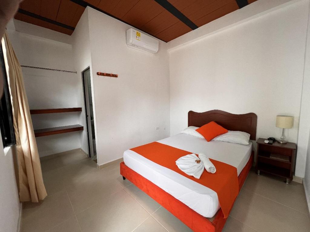 Postel nebo postele na pokoji v ubytování Hotel Colonial Villavieja