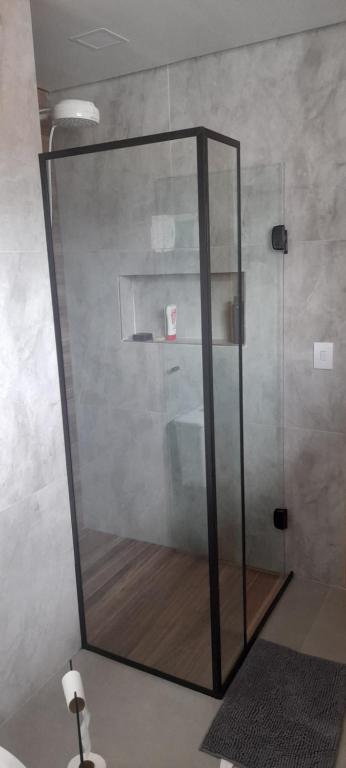 a shower with a glass door in a bathroom at Casa Ilhabela in Ilhabela