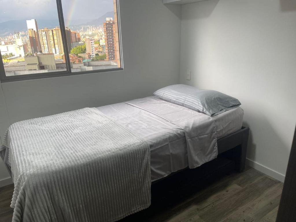 En eller flere senge i et værelse på Magnífico apartamento