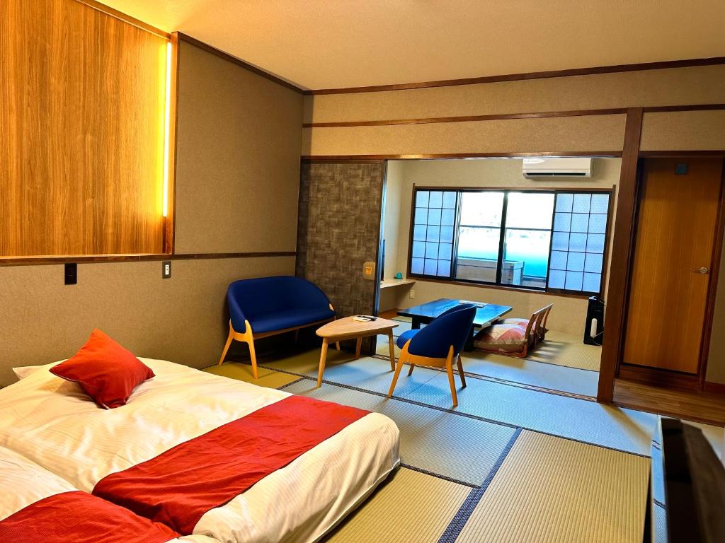 Postel nebo postele na pokoji v ubytování Inatori Akao Hotel