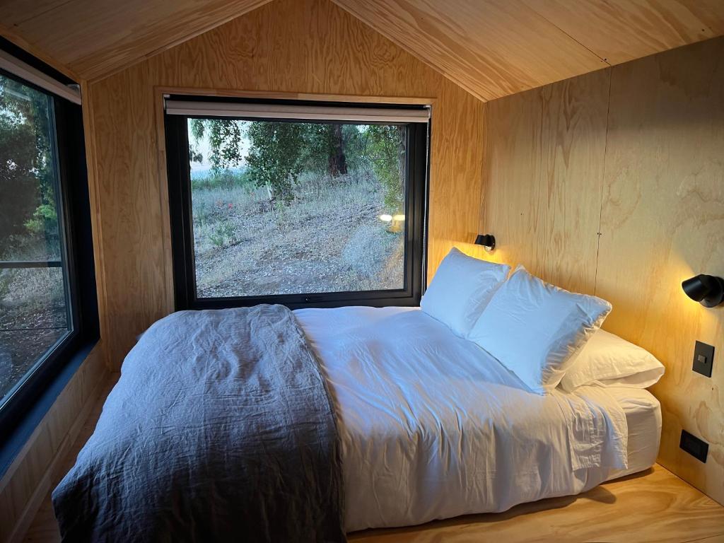 Postel nebo postele na pokoji v ubytování Cabaña en Santuario El Ajial - Paine - Tucu Cabins