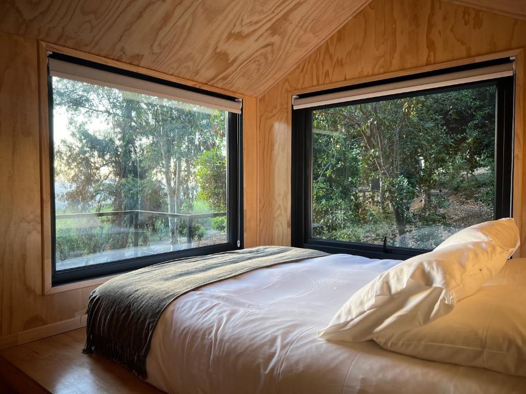 Postel nebo postele na pokoji v ubytování Cabaña en Santuario El Ajial - Paine - Tucu Cabins