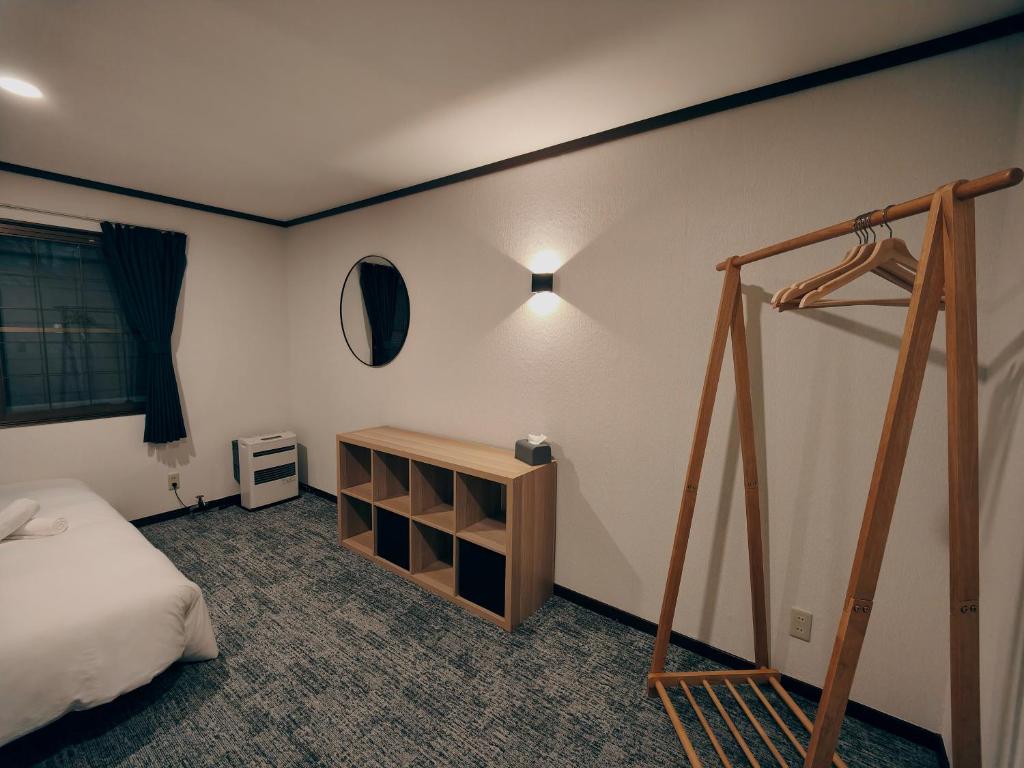 Postel nebo postele na pokoji v ubytování Hotel Foxtrot Hakuba