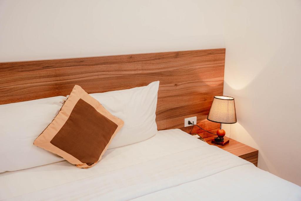 Postel nebo postele na pokoji v ubytování Hotel A89 Rosarian