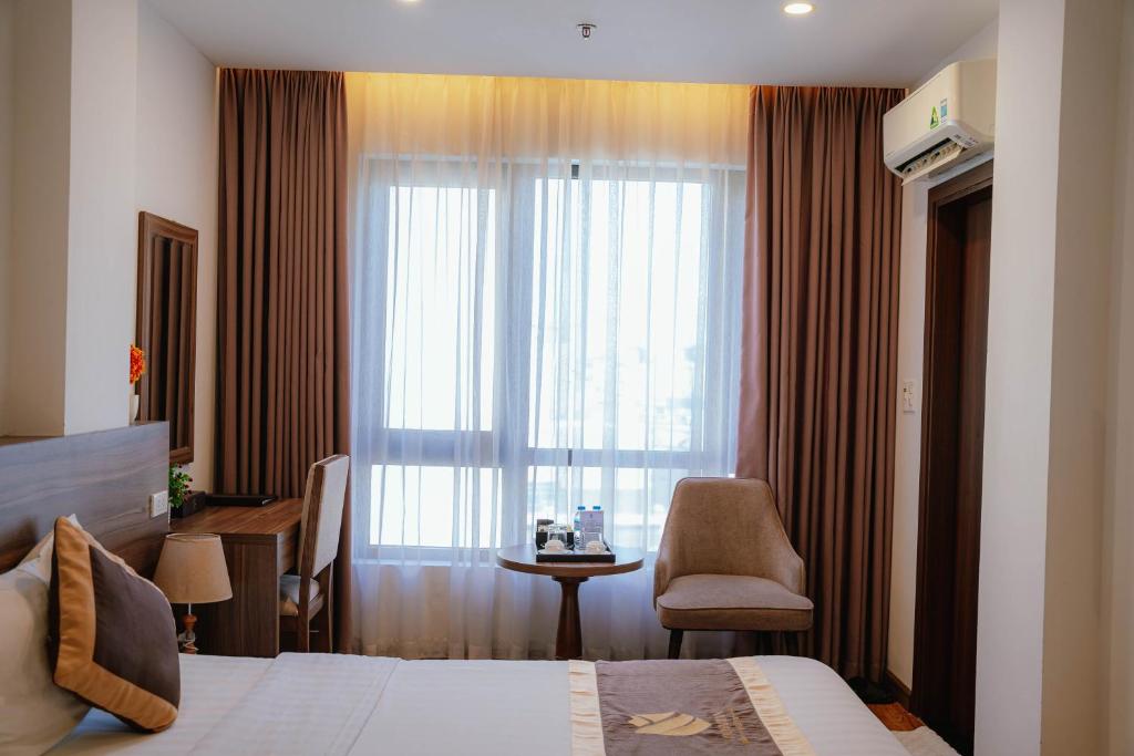 Postel nebo postele na pokoji v ubytování Hotel A89 Rosarian