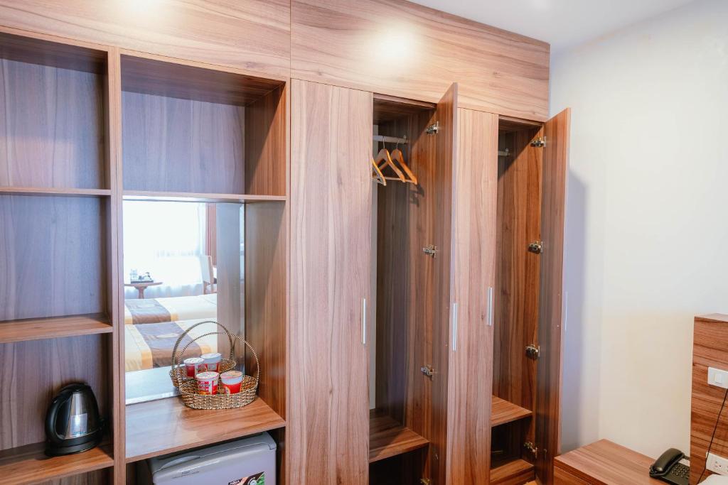 Kuchyň nebo kuchyňský kout v ubytování Hotel A89 Rosarian