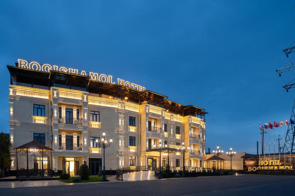 a building with a sign on the front of it at Bogishamol Hotel in Samarkand