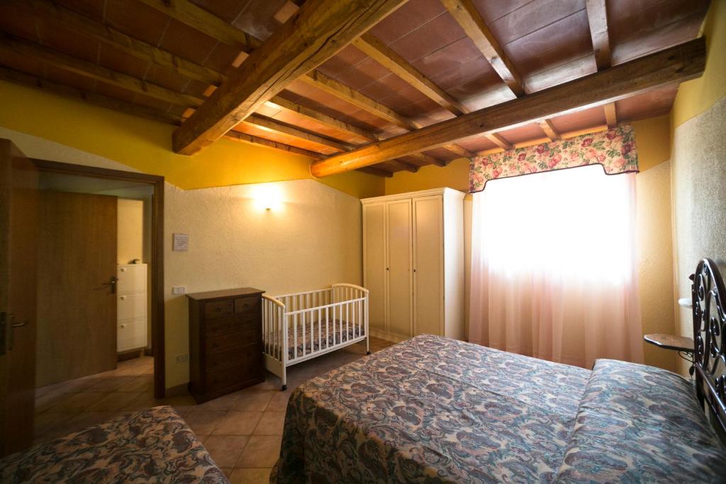 A bed or beds in a room at Agriturismo Valdo