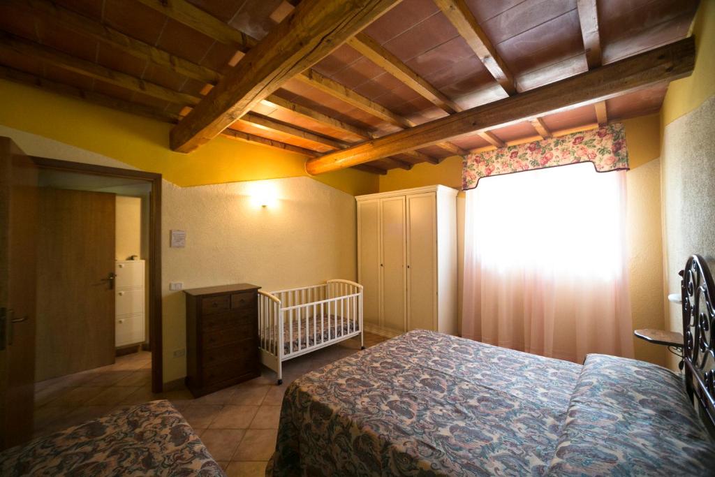 Ένα ή περισσότερα κρεβάτια σε δωμάτιο στο Agriturismo Valdo