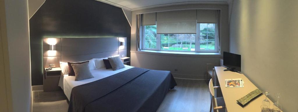 Postel nebo postele na pokoji v ubytování Hotel Igeretxe