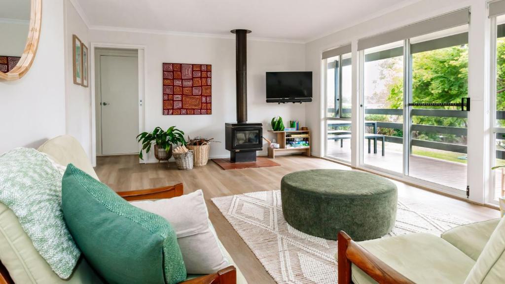 a living room with a couch and a table at The Holiday Shack at Flinders in Flinders