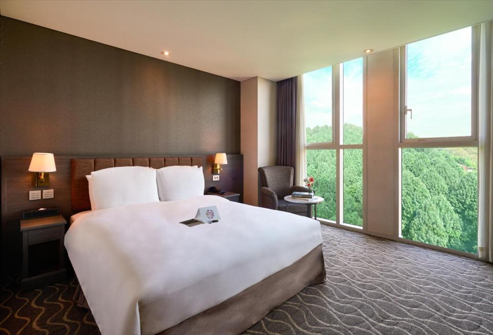 Postel nebo postele na pokoji v ubytování Hotel Square Ansan