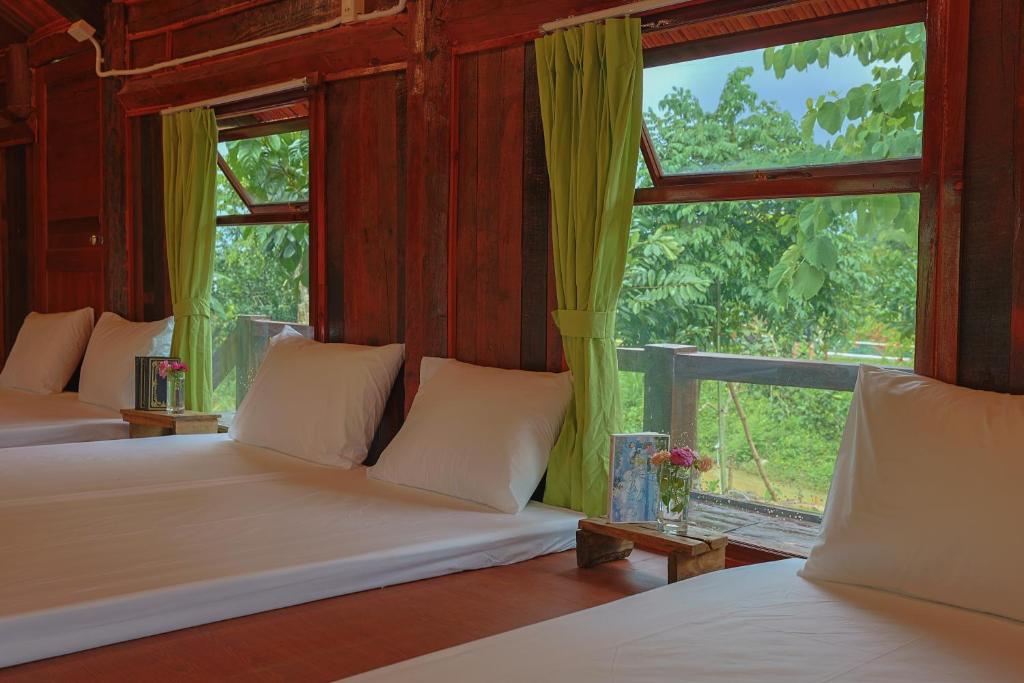 Postel nebo postele na pokoji v ubytování Sundara Retreat