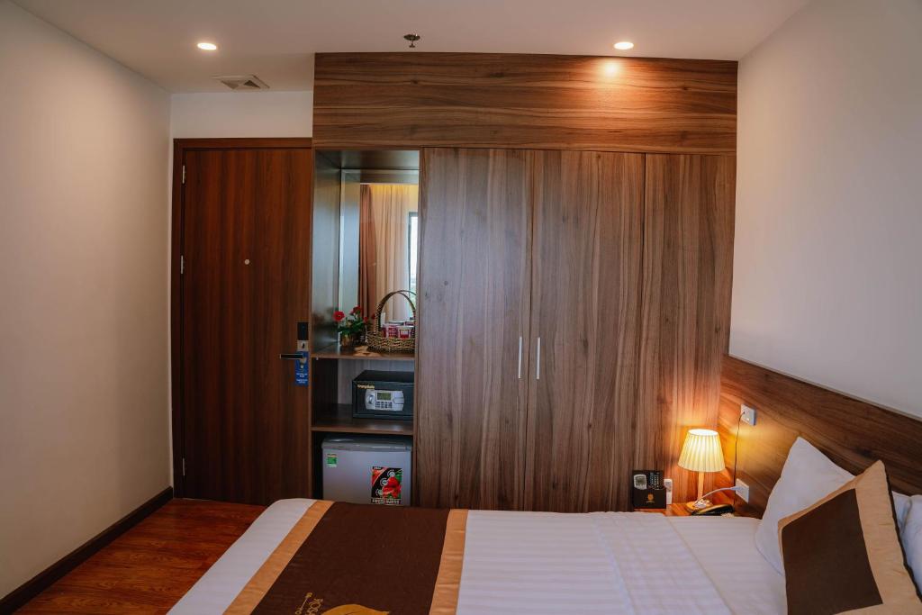 Postel nebo postele na pokoji v ubytování Hotel A89 Rosarian