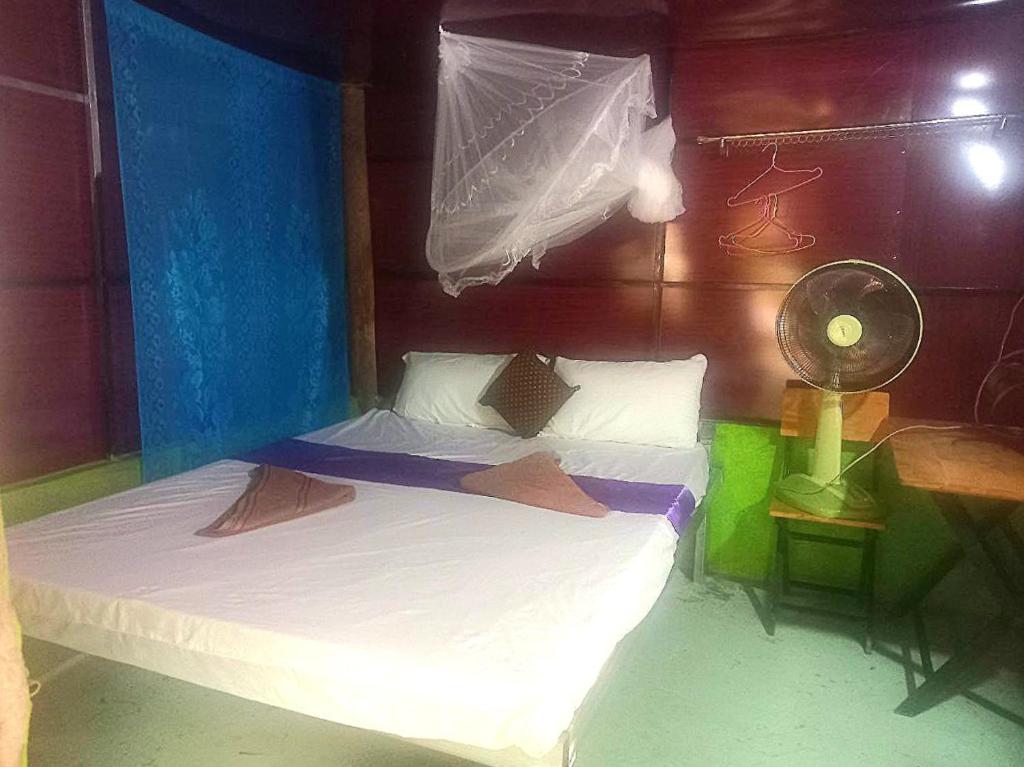 Postel nebo postele na pokoji v ubytování Jungle House Kep