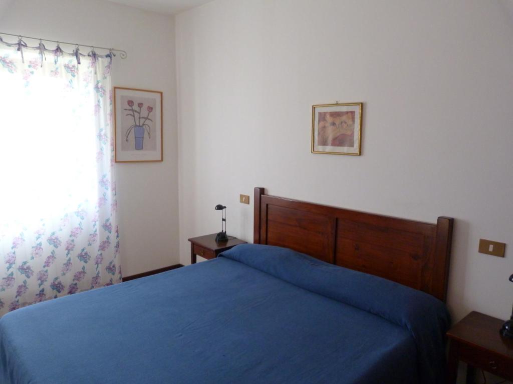 Postel nebo postele na pokoji v ubytování La Locanda del Collaccio