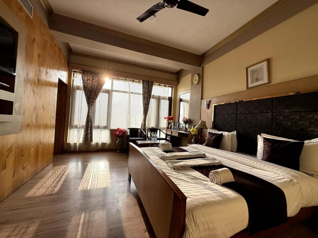 Postel nebo postele na pokoji v ubytování Hotel New Mamta
