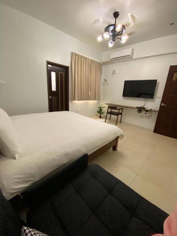 TV a/nebo společenská místnost v ubytování Fangliao 9453 B&B