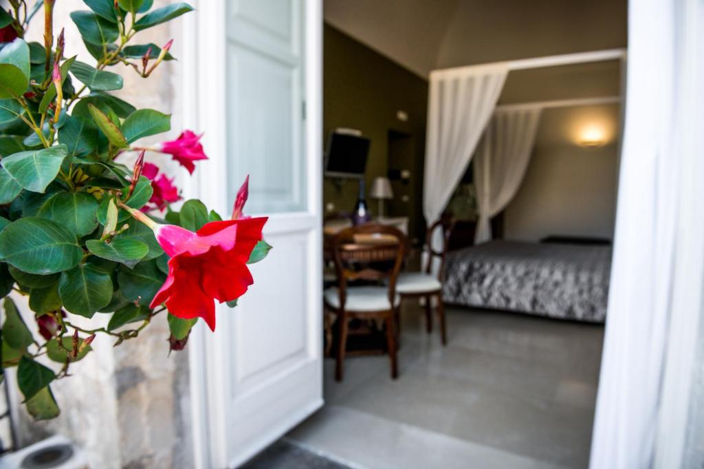 Postel nebo postele na pokoji v ubytování Albergo Del Sedile