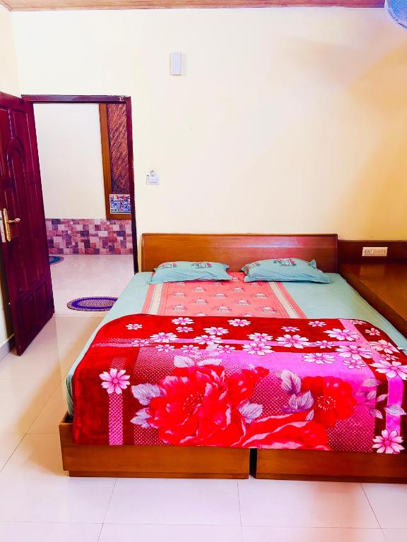 Postel nebo postele na pokoji v ubytování Rainbow mist Homestay