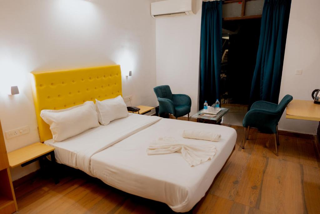 Postel nebo postele na pokoji v ubytování Jolly Panda Resort Goa