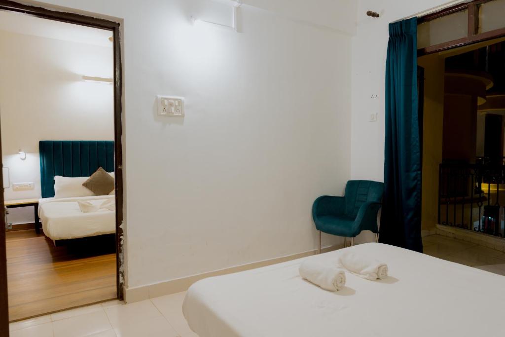 Postel nebo postele na pokoji v ubytování Jolly Panda Resort Goa