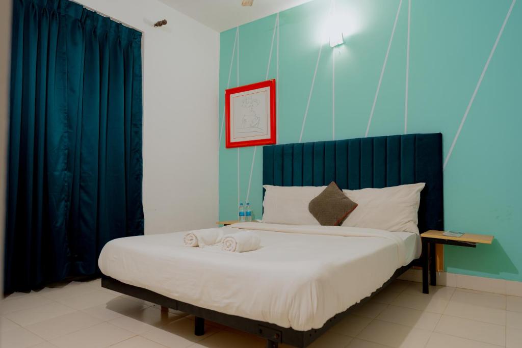 Postel nebo postele na pokoji v ubytování Jolly Panda Resort Goa