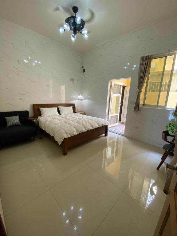 Postel nebo postele na pokoji v ubytování Fangliao 9453 B&B